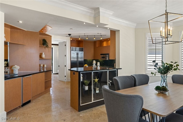 dining room featuring recessed lighting, a notable chandelier, and crown molding