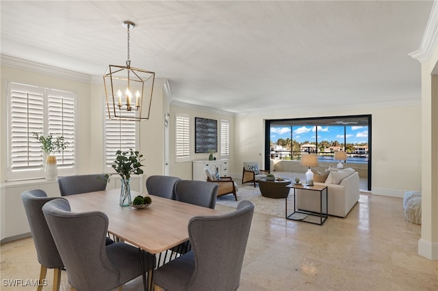 dining area with a notable chandelier, a wealth of natural light, and ornamental molding