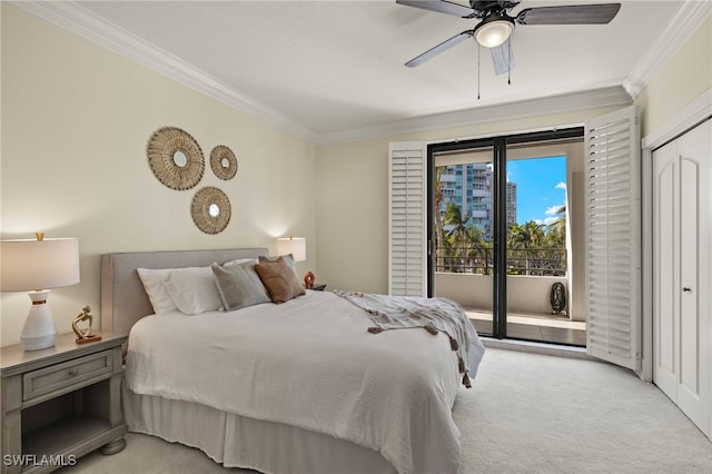 carpeted bedroom featuring a closet, access to exterior, ceiling fan, and crown molding