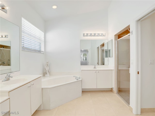 bathroom featuring tile patterned flooring, vanity, separate shower and tub, and a healthy amount of sunlight