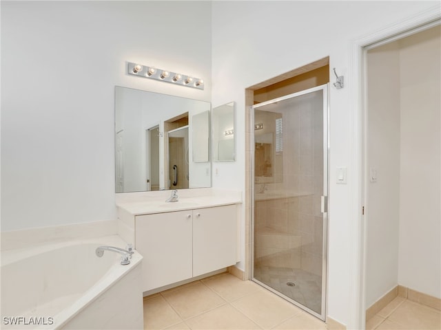 bathroom featuring vanity, separate shower and tub, and tile patterned floors