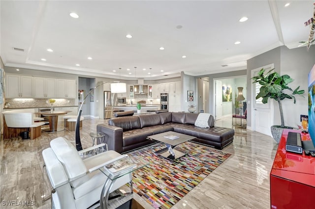 living room featuring ornamental molding and a tray ceiling