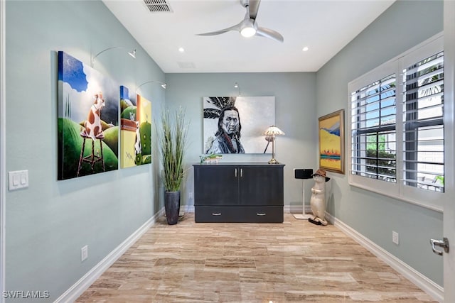 interior space featuring ceiling fan