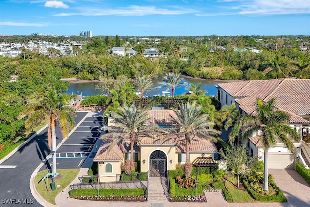 birds eye view of property with a water view