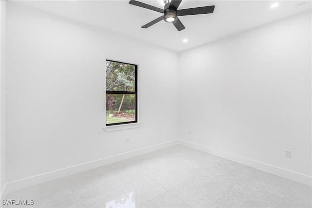 tiled empty room with ceiling fan