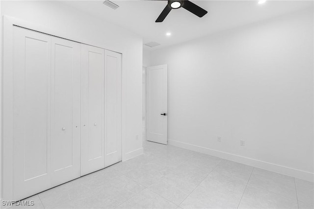 unfurnished bedroom featuring a closet and ceiling fan