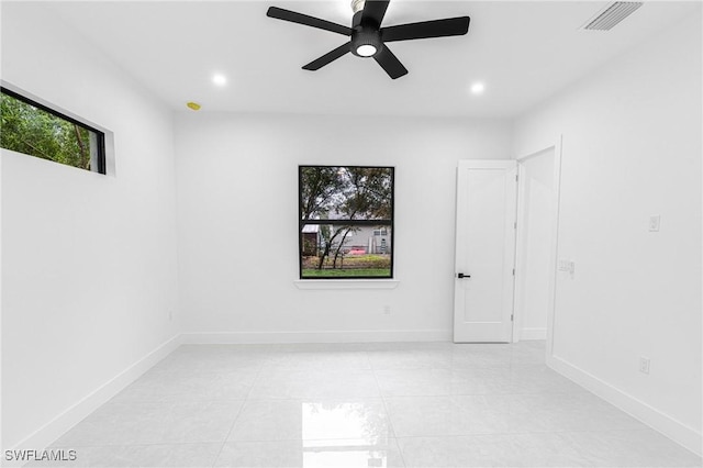 unfurnished room with ceiling fan