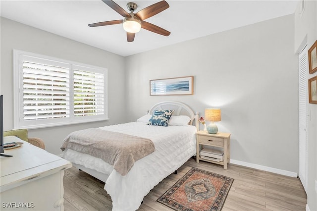 bedroom featuring ceiling fan and light hardwood / wood-style flooring