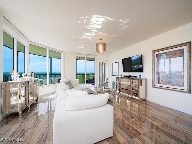 1065 Borghese Ln Unit 701, Naples, FL 34114 - living area with baseboards