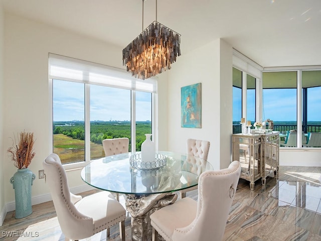 1065 Borghese Ln Unit 701, Naples, FL 34114 - dining area with a chandelier