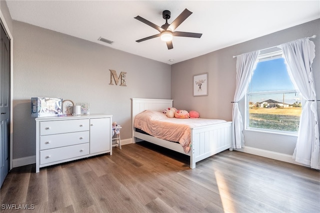 bedroom featuring hardwood / wood-style floors and ceiling fan