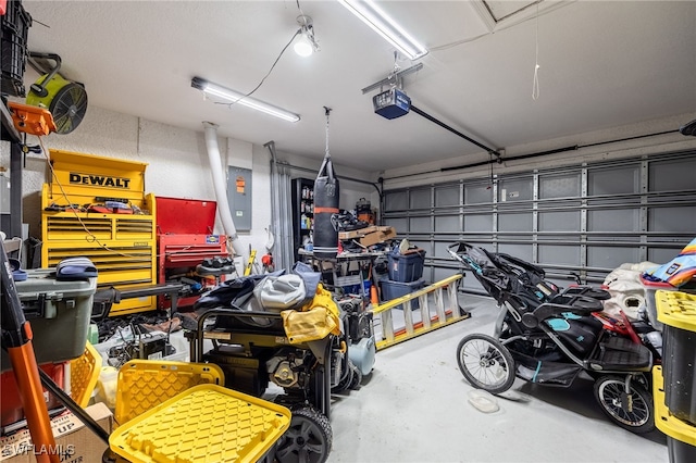 garage featuring electric panel and a garage door opener