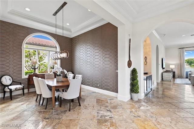 dining room featuring wallpapered walls and an accent wall