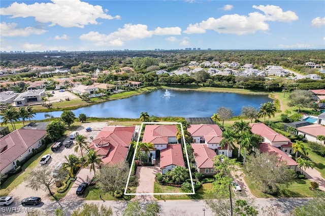 aerial view with a residential view and a water view