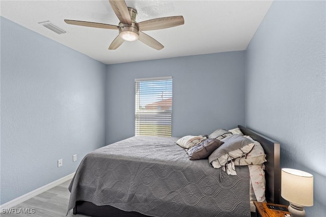 bedroom featuring ceiling fan and hardwood / wood-style floors