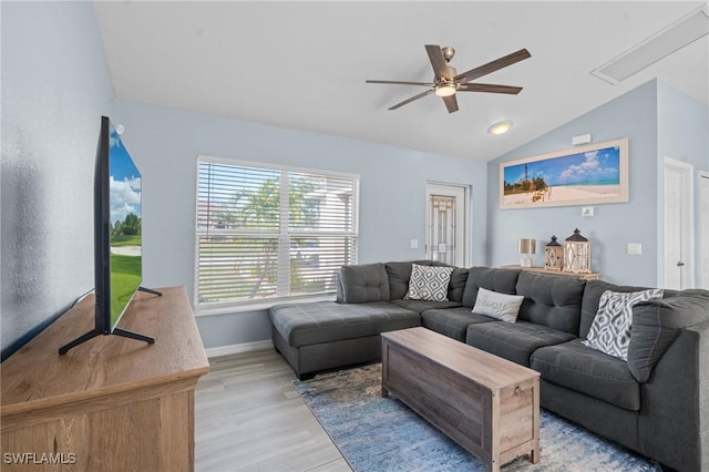 living room with light wood-type flooring, vaulted ceiling, and ceiling fan