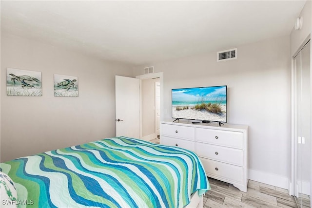 bedroom with light wood-type flooring