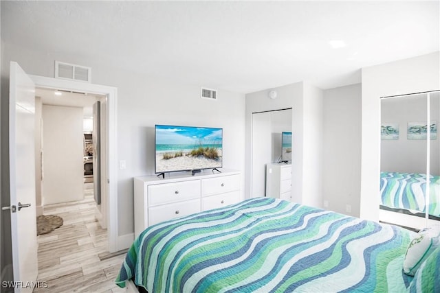 bedroom with light wood-type flooring