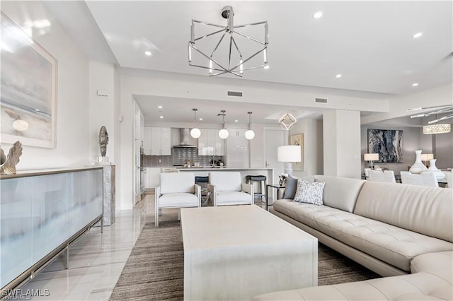 living room featuring an inviting chandelier