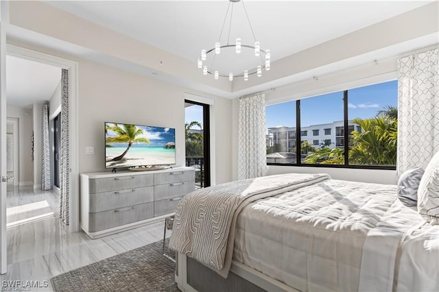 bedroom featuring an inviting chandelier