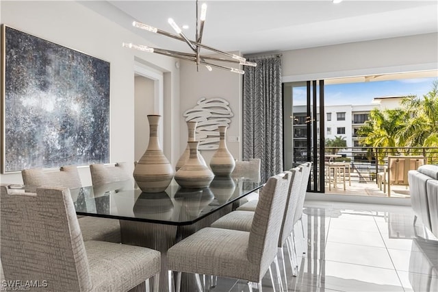 dining area with tile patterned flooring and a notable chandelier