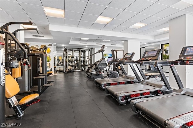 exercise room with a drop ceiling