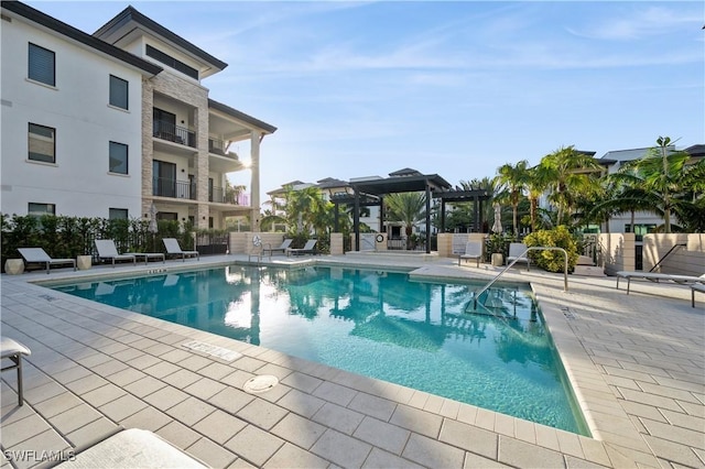 view of swimming pool with a pergola and a patio area