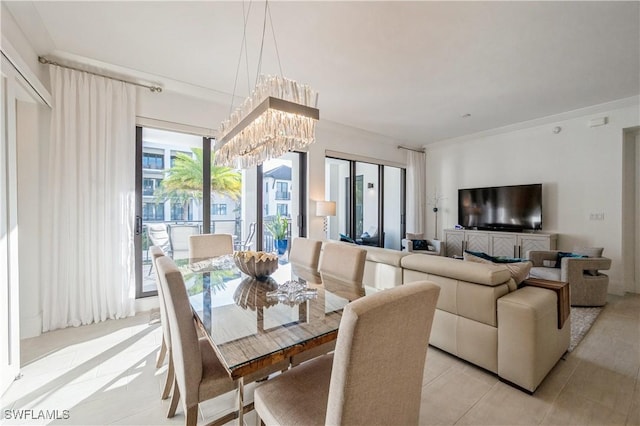 dining area with light tile patterned flooring and a notable chandelier