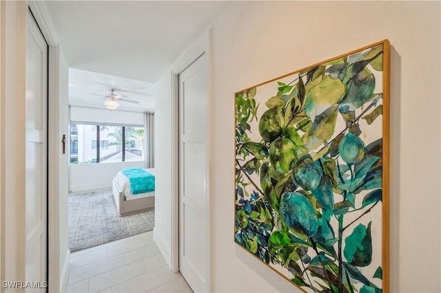 hallway with light tile patterned floors