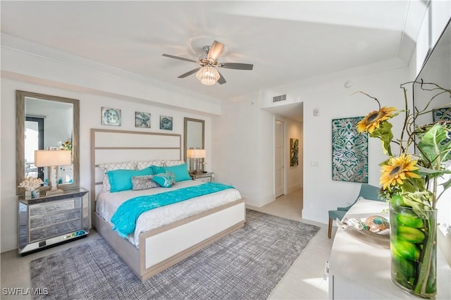 bedroom featuring ceiling fan and ornamental molding