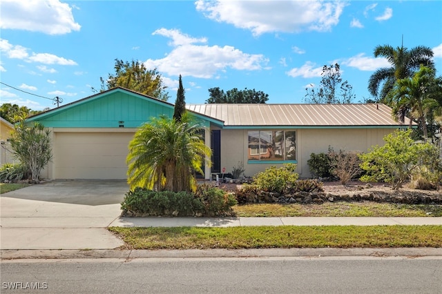 single story home featuring a garage