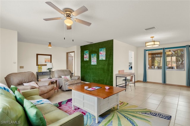 living room featuring ceiling fan and light tile patterned floors