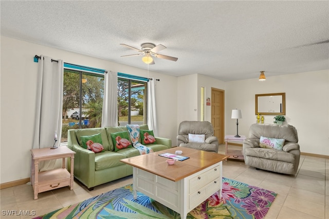 tiled living room with ceiling fan and a textured ceiling