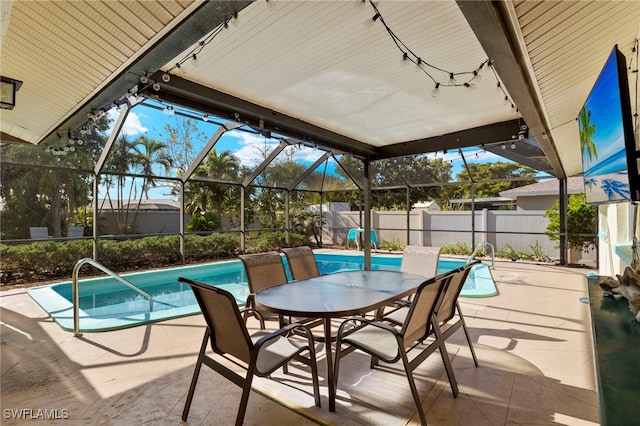 view of patio with a fenced in pool and a lanai