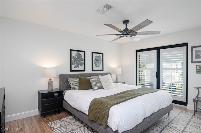 bedroom with ceiling fan and hardwood / wood-style flooring