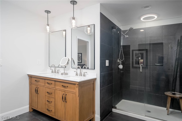 bathroom with tile patterned flooring, vanity, and a shower with shower door