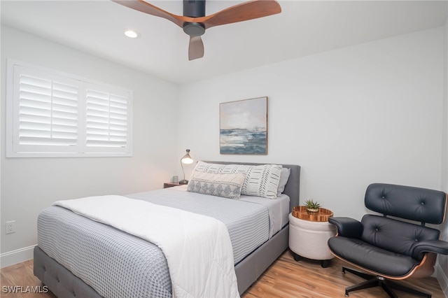 bedroom with hardwood / wood-style flooring and ceiling fan