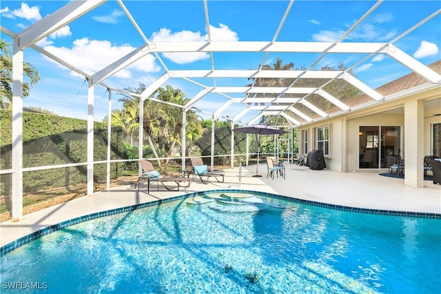 outdoor pool featuring a patio and a lanai