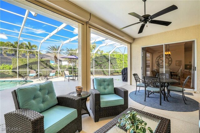 view of patio / terrace with an outdoor hangout area, ceiling fan, and a lanai