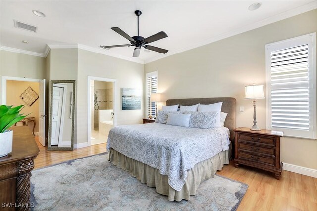 bedroom with ensuite bath, ceiling fan, light hardwood / wood-style flooring, and crown molding