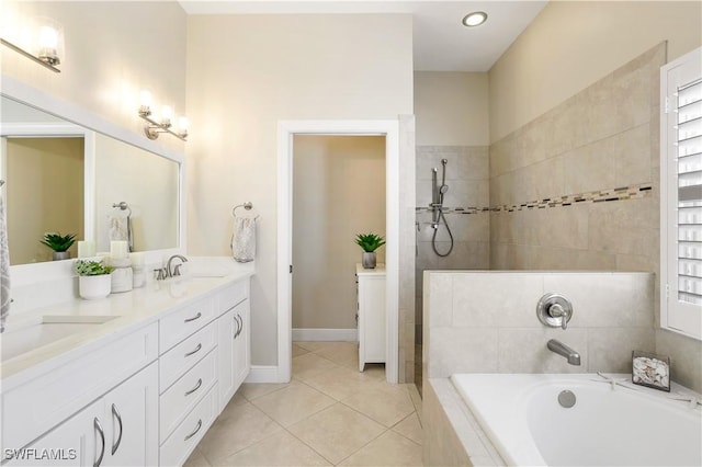 full bathroom featuring double vanity, tile patterned floors, walk in shower, a bath, and a sink
