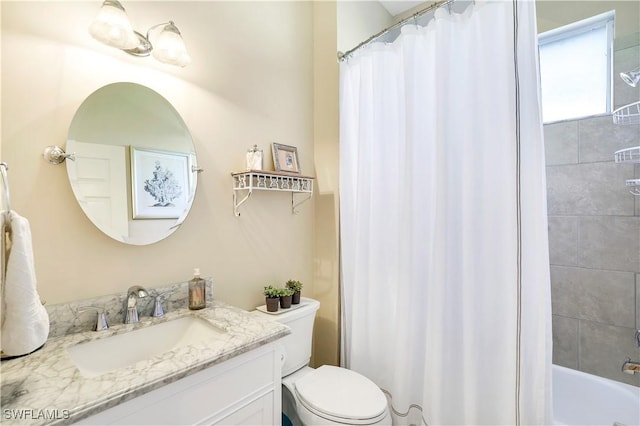 full bathroom featuring vanity and toilet