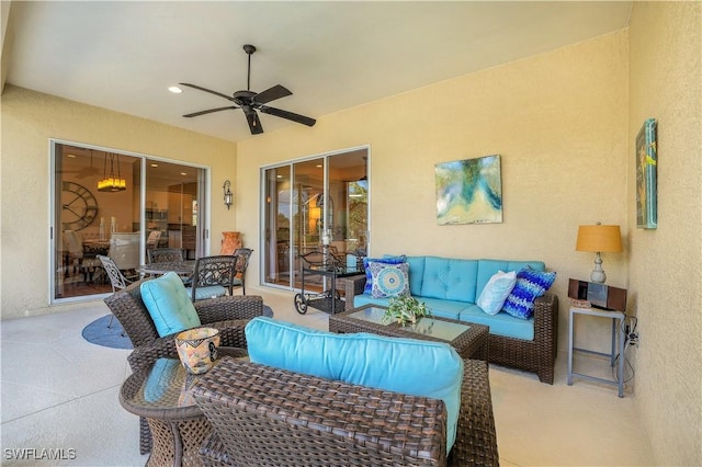 view of patio featuring ceiling fan and an outdoor living space