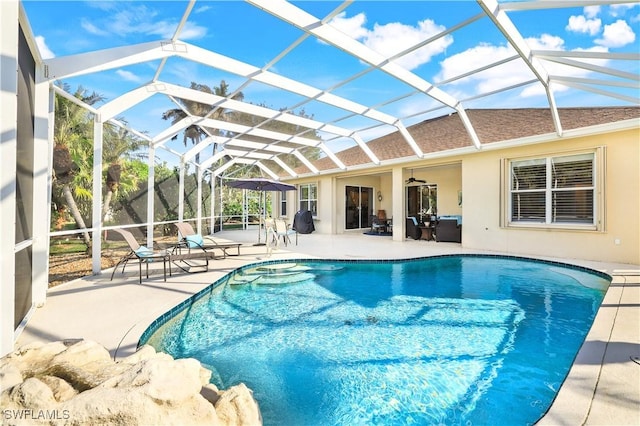 outdoor pool featuring a lanai and a patio