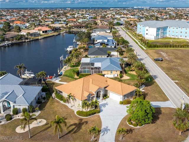 birds eye view of property with a water view