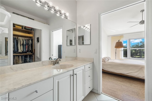 bathroom featuring tile patterned floors, ceiling fan, and vanity