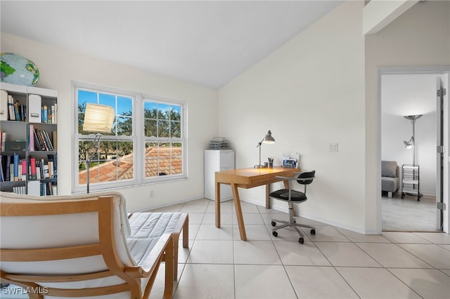 tiled home office featuring lofted ceiling