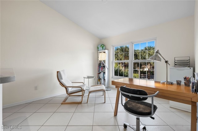 office featuring light tile patterned floors and lofted ceiling