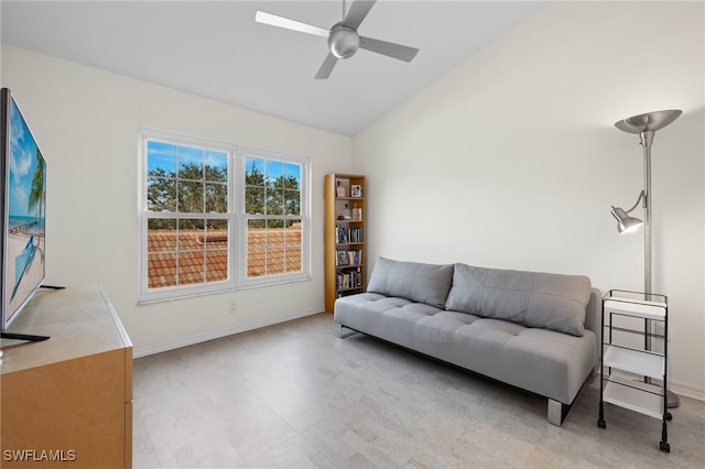 living room with ceiling fan and lofted ceiling