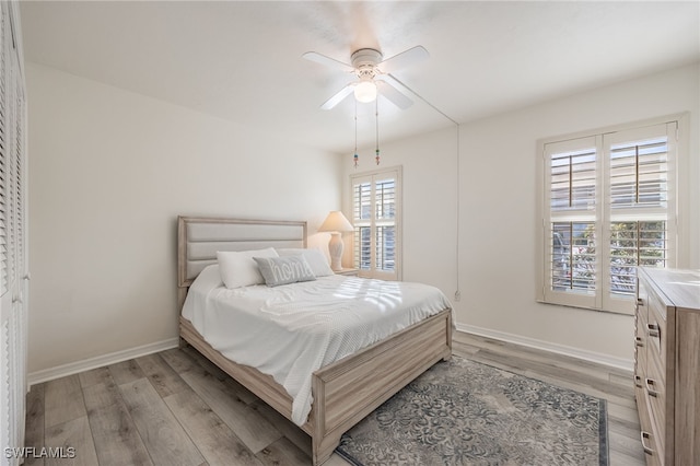 bedroom featuring ceiling fan and light hardwood / wood-style flooring